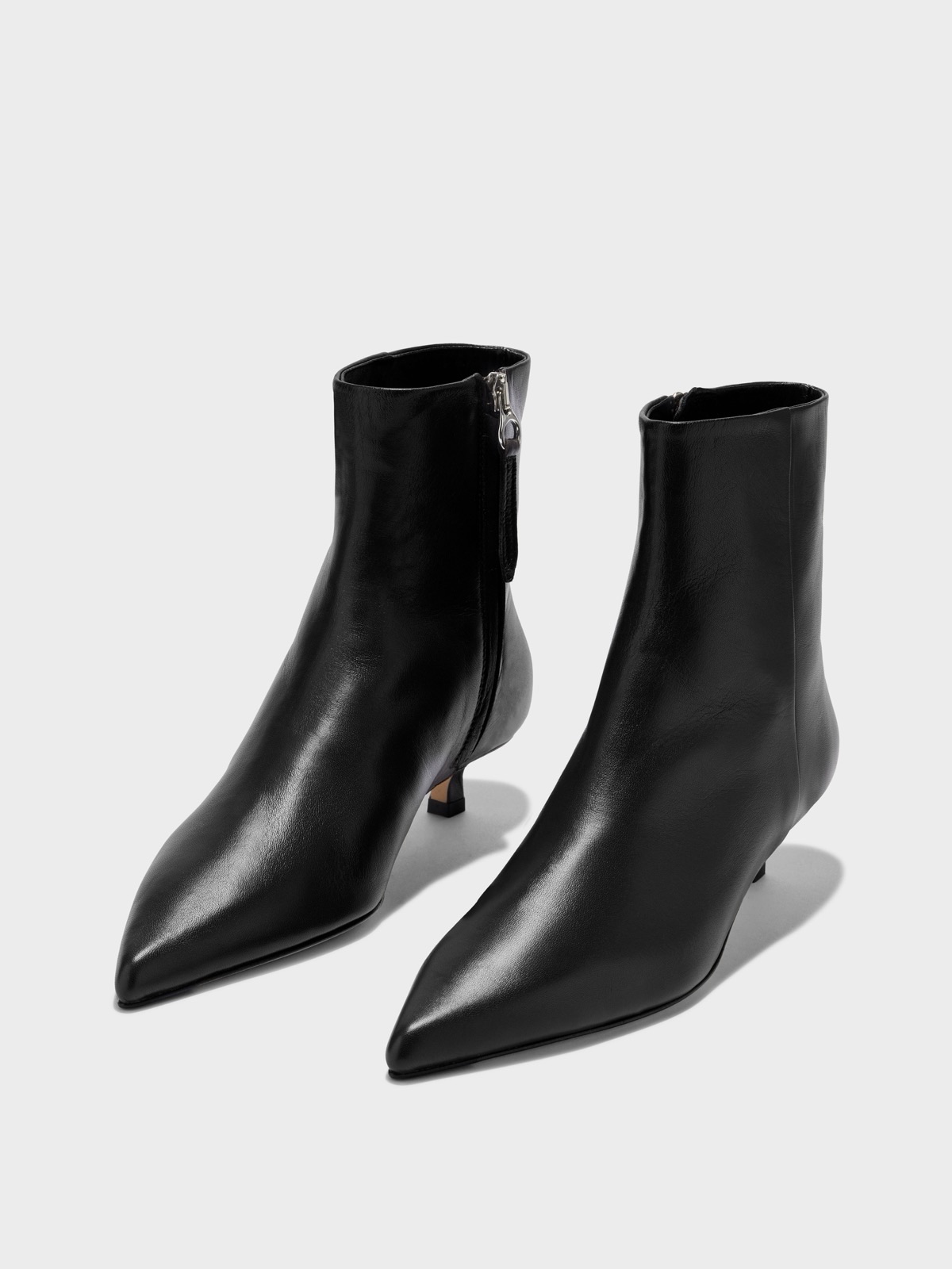 Black AEYDE Sofie ankle boots showing the pointed toe and kitten heel