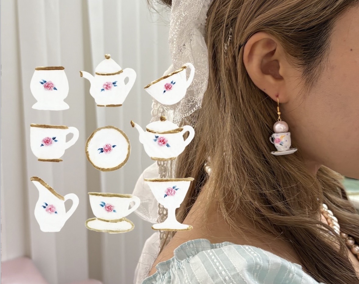 Profile wearing a tiny teacup earring, with a collage of miniature floral cups, saucers and teapots alongside.