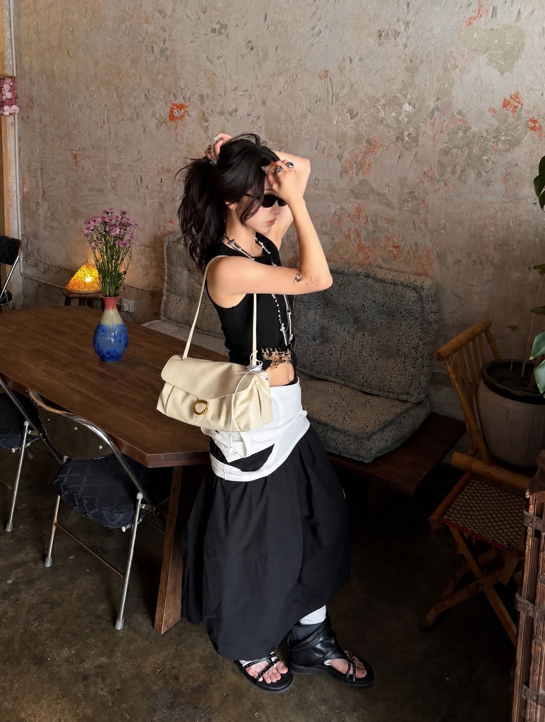 city girl outfit with a cropped tank, soft bag, and loose bottoms