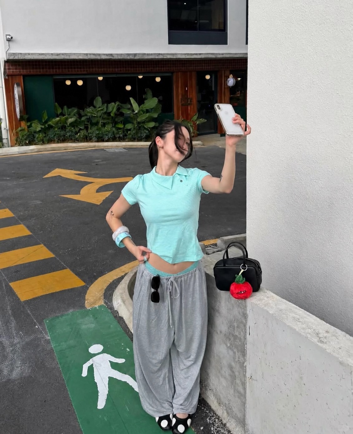 fitted sleeveless top with floral cargo pants and playful accessories