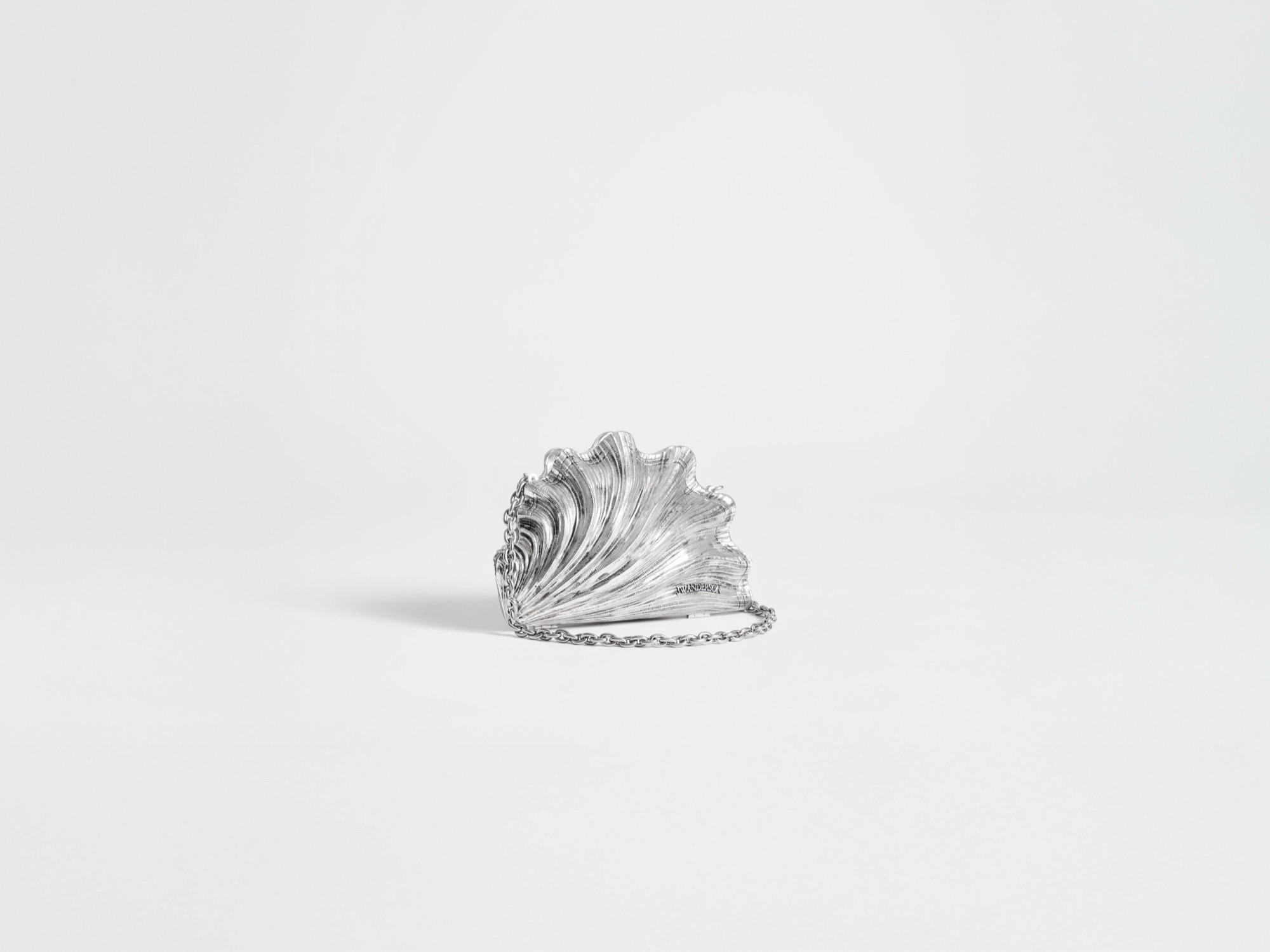 JW Anderson shell-shaped clutch with a sculptural white silhouette