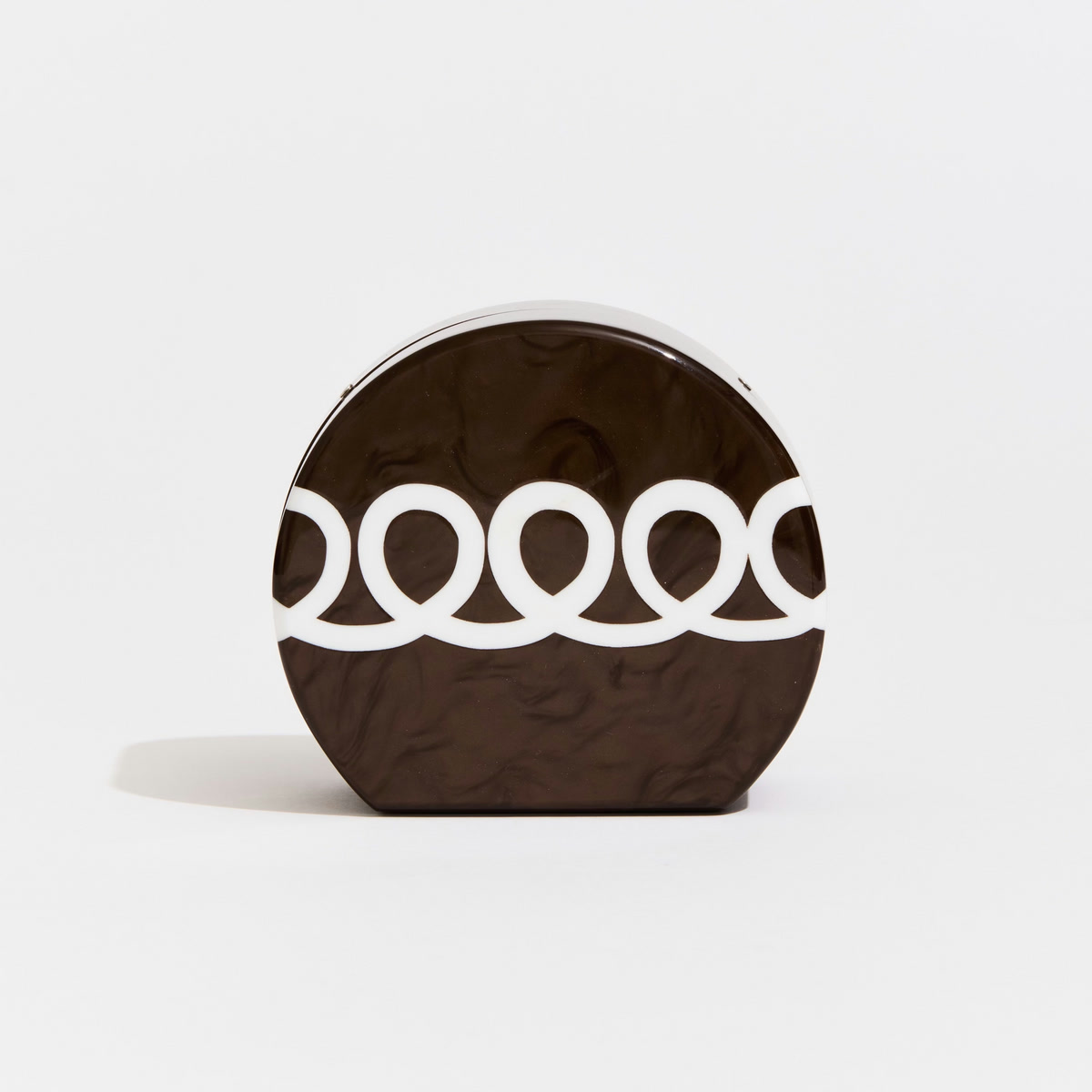 Edie Parker acrylic clutch with a graphic circular silhouette
