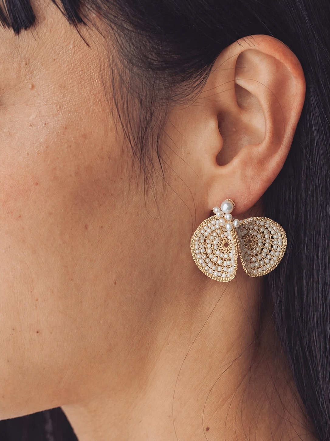 FUA pearl and beaded statement earring in close-up