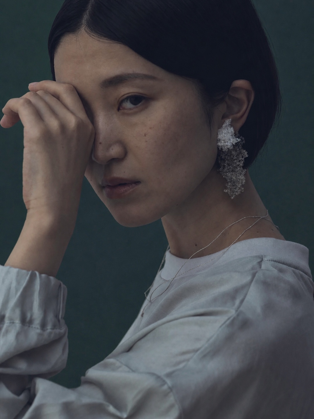 FUA white beaded bracelet and long necklace in a soft portrait