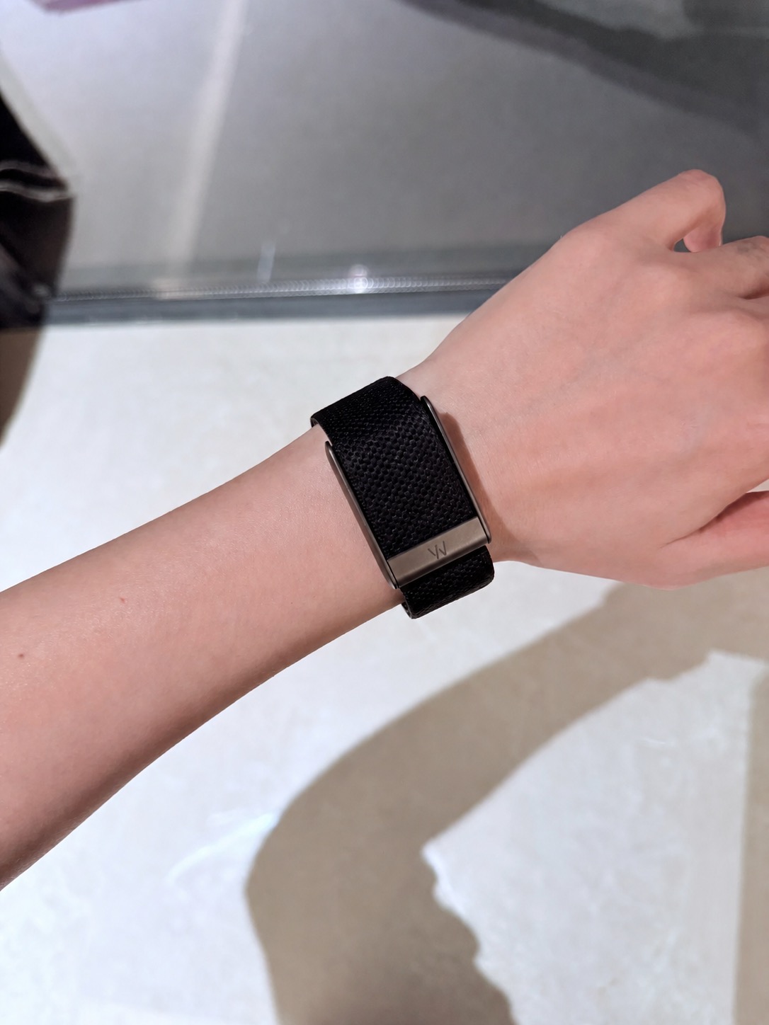 WHOOP 5.0 black screenless fitness tracker worn on wrist