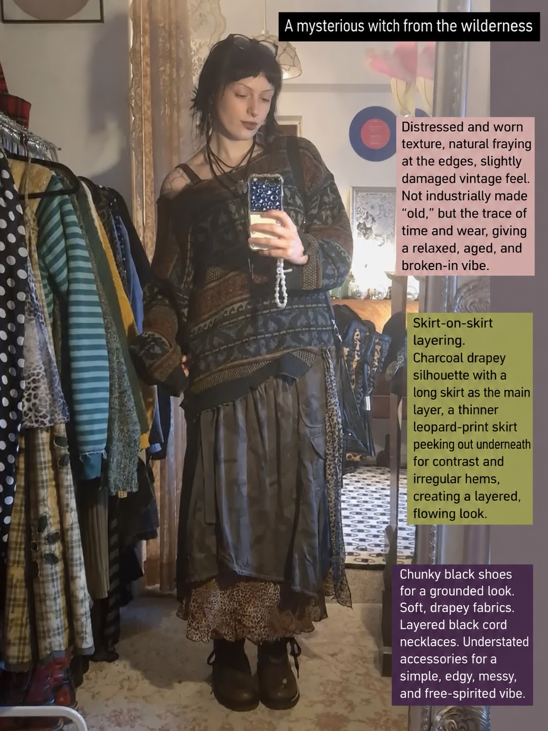 Mirror selfie of a sheer dark patterned top, layered grey and leopard-print skirts and black boots