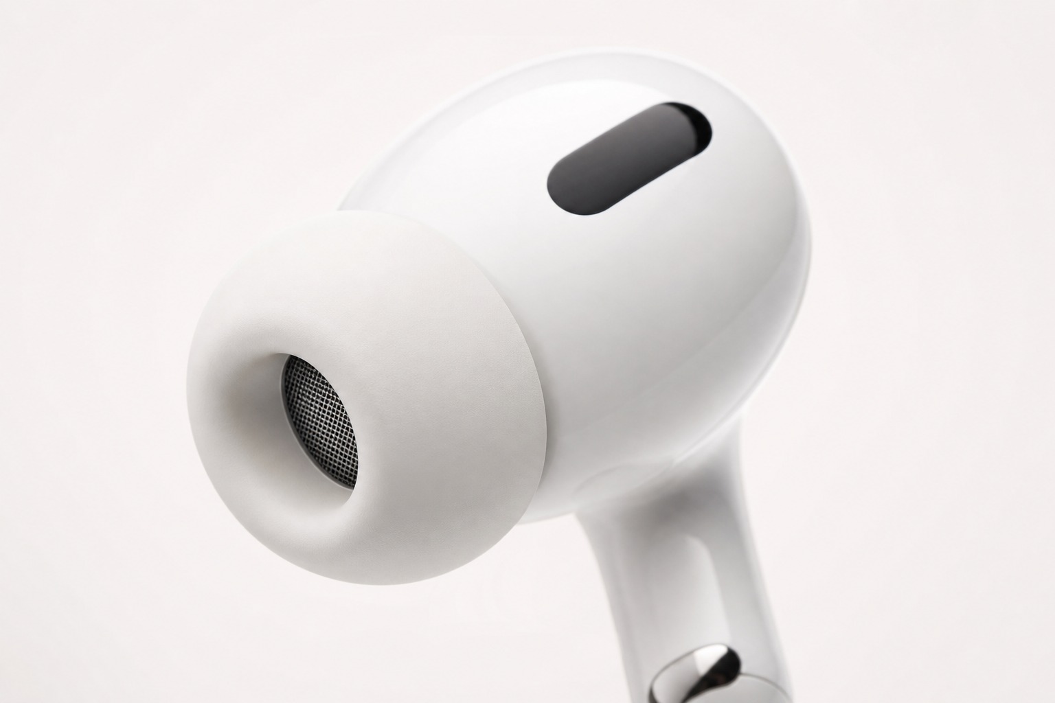 Close-up of an AirPods Pro style sealed earbud with a prominent silicone ear tip.