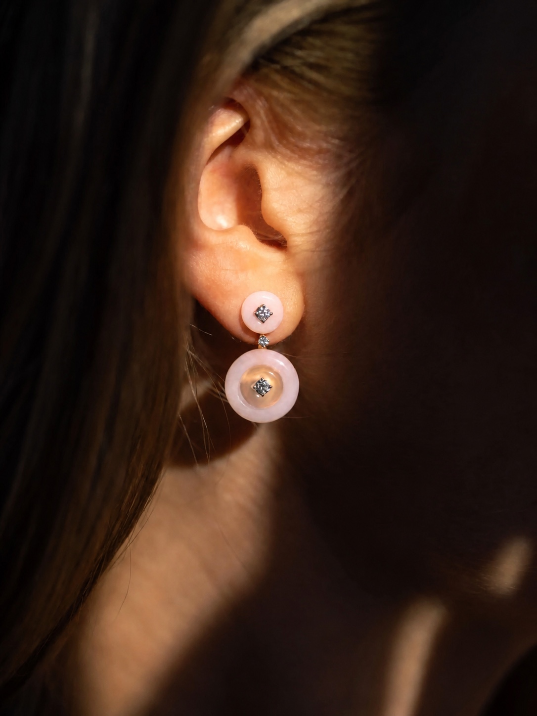 Fernando Jorge pearl statement earring in a close-up portrait
