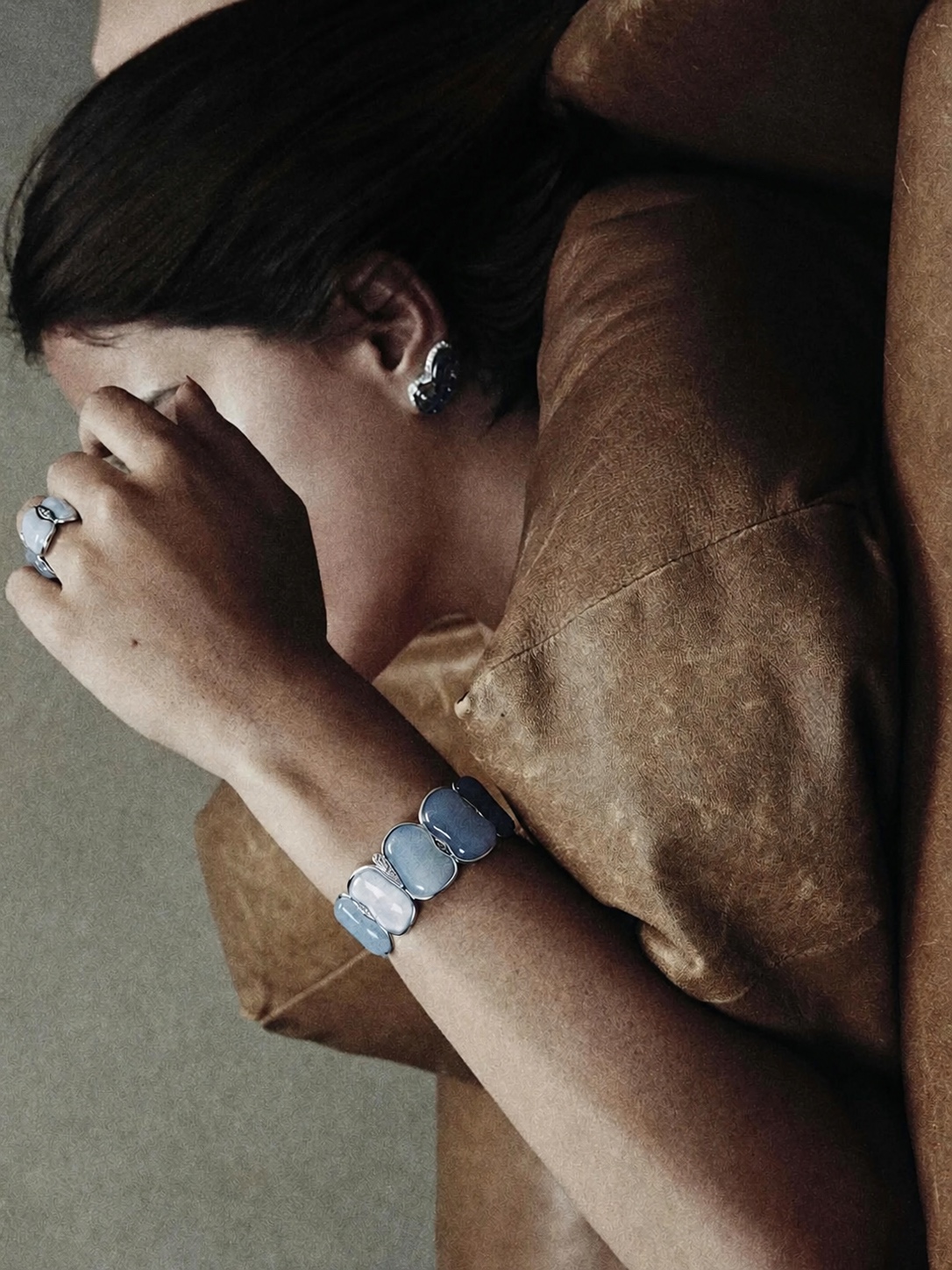 Fernando Jorge colorful gemstone rings on hands