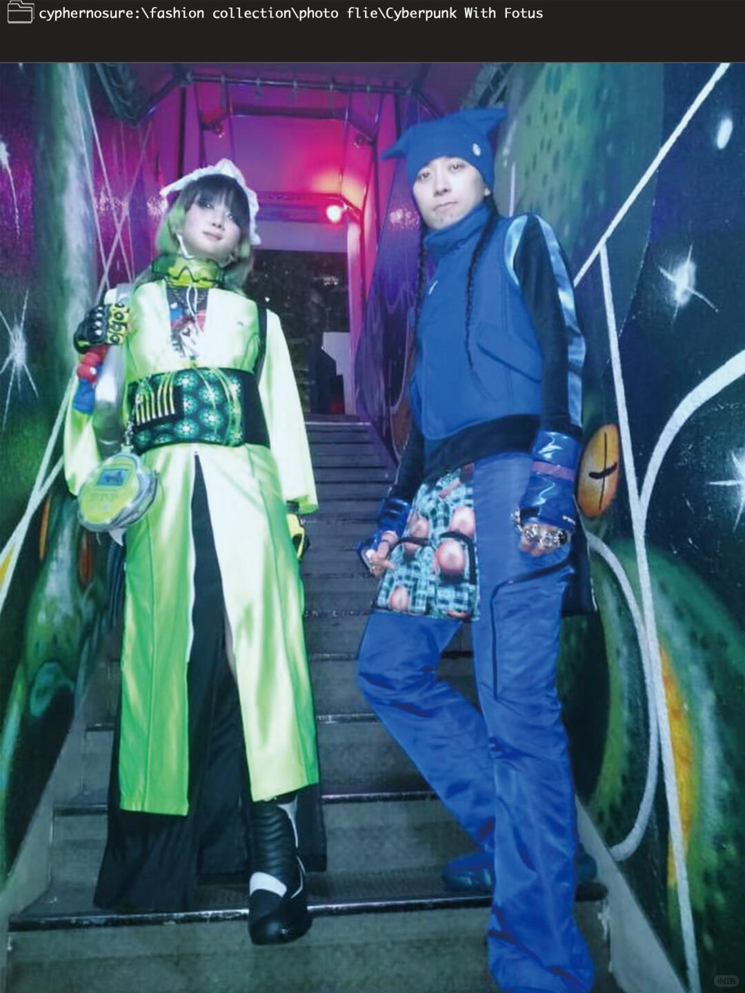 Futuristic blue and black outfit with body-conscious panels