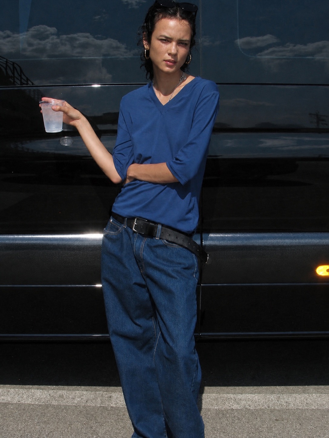 A unisex outfit idea with loose trousers, layered texture, and creative styling