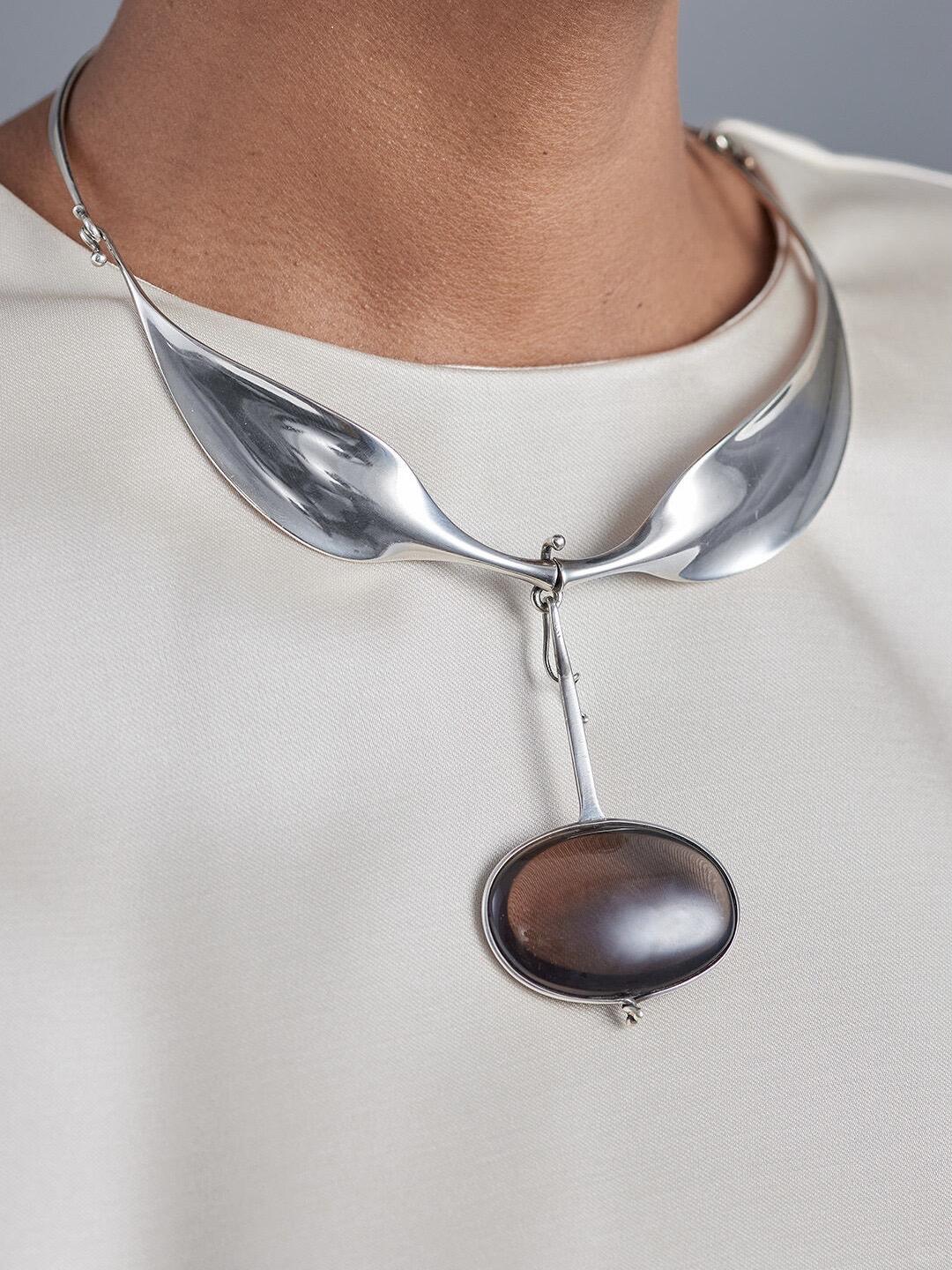 Sculptural silver Georg Jensen neckpiece on a white background