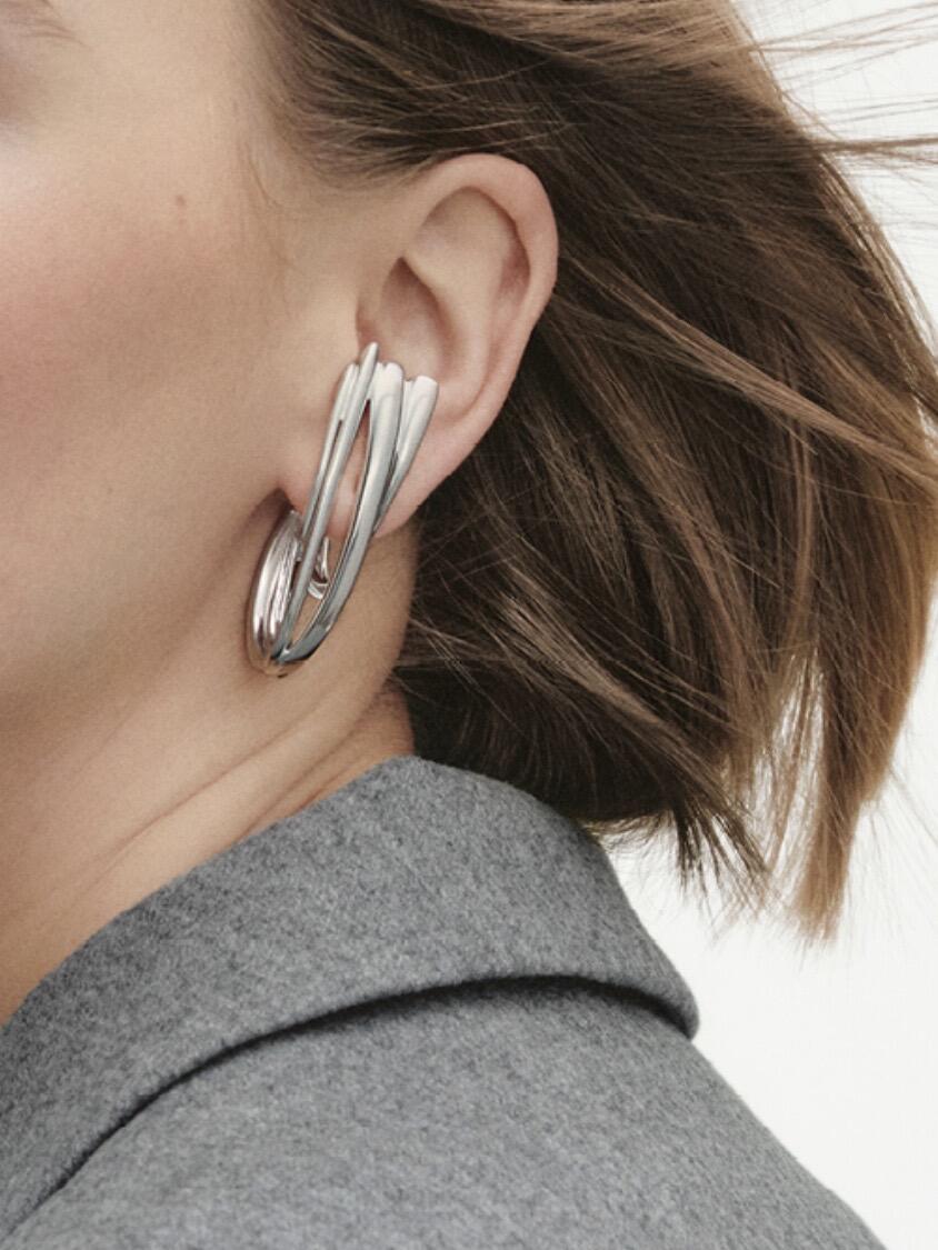 Silver Georg Jensen ear cuff worn on an ear