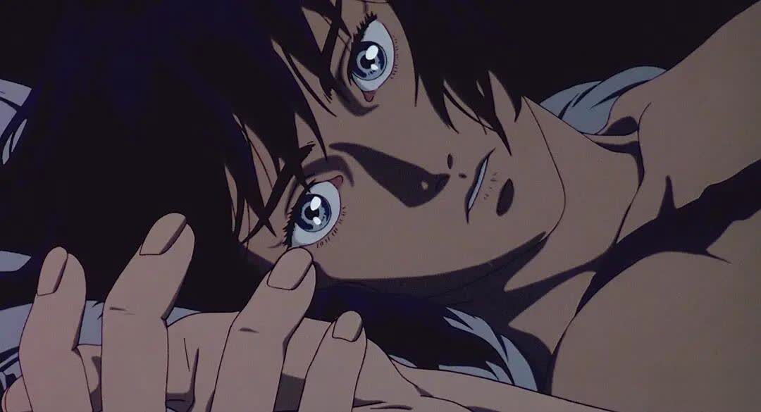 Ghost in the Shell 1995 anime scene with a dense futuristic city background