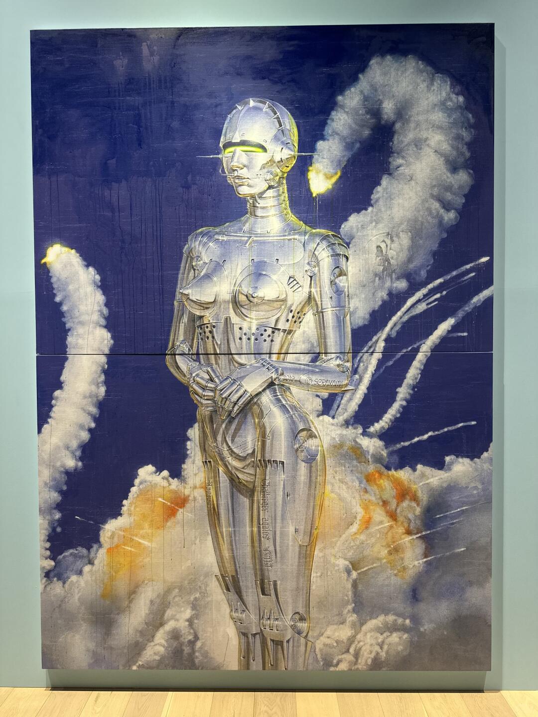 Painting of chrome female robot standing against clouds and blue background