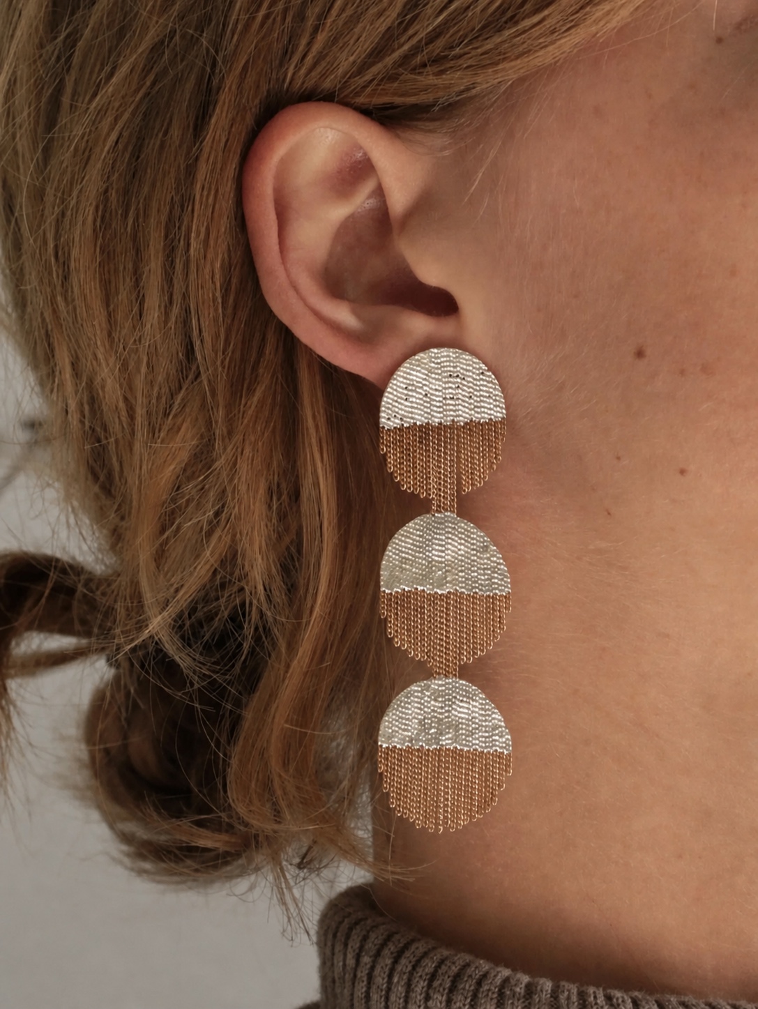 Large circular Hannah Keefe silver and gold chain earring