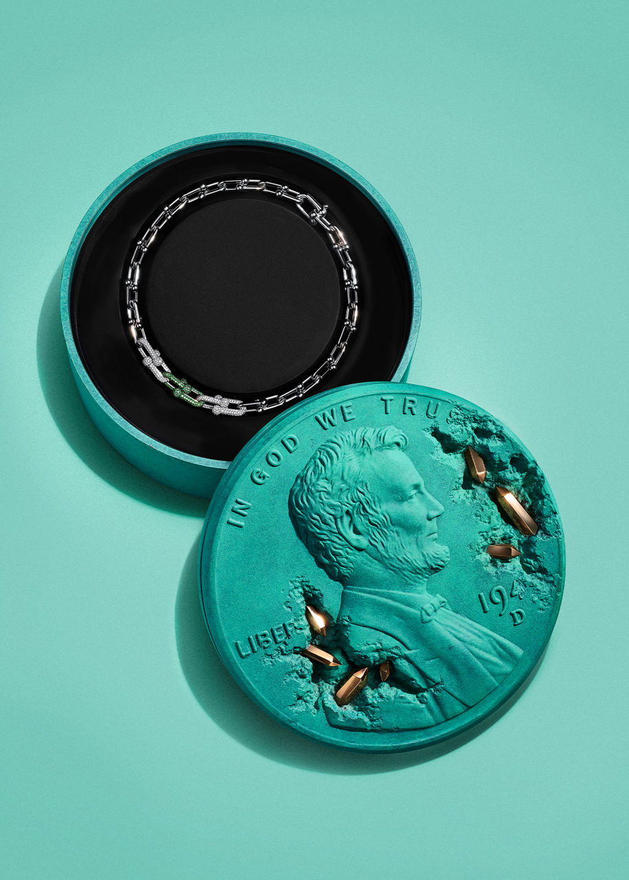 Tiffany and Daniel Arsham's Bronze Eroded Penny Vessel with a patinated surface and crystal details.