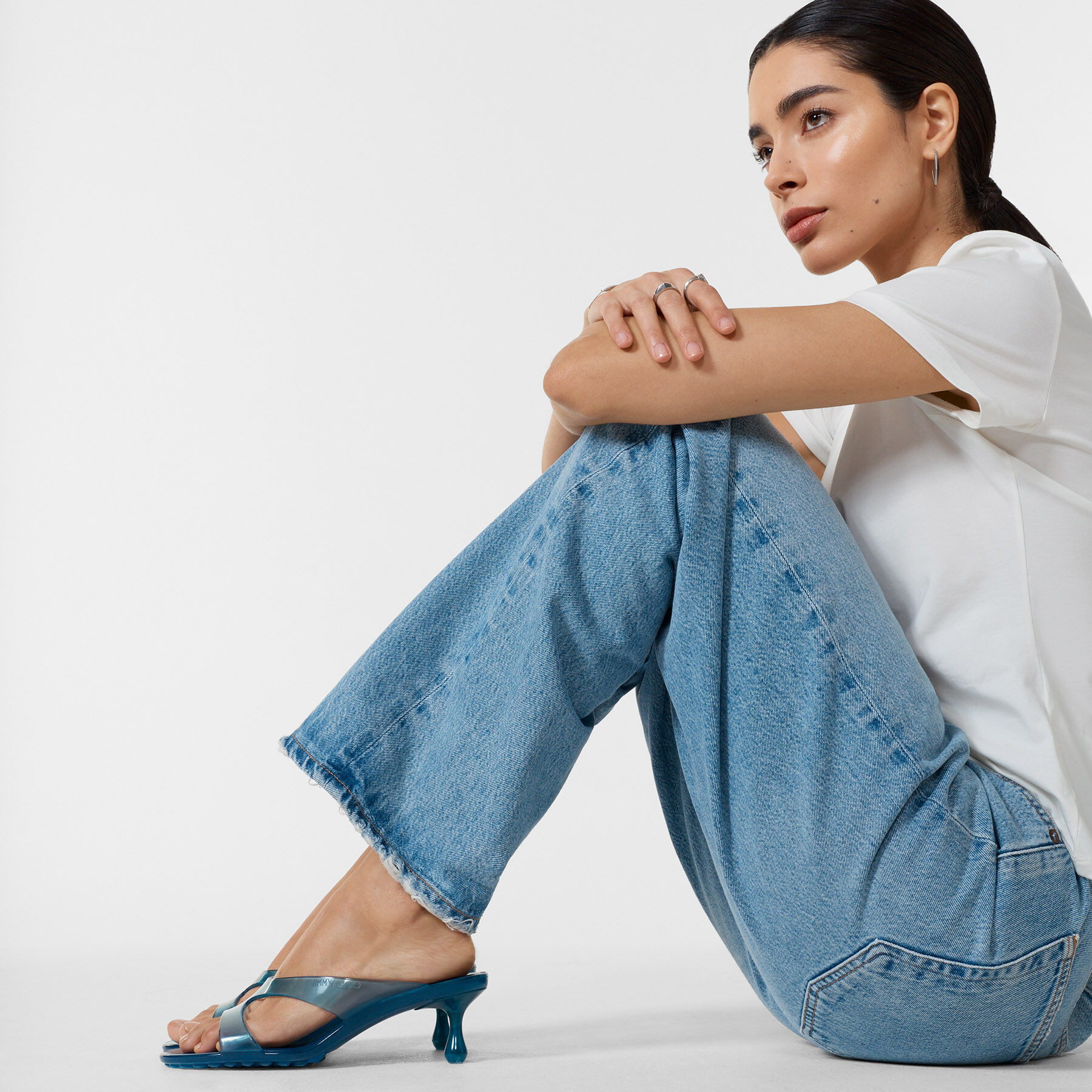 Jimmy Choo blue Jelly Drop kitten heels styled with wide-leg denim