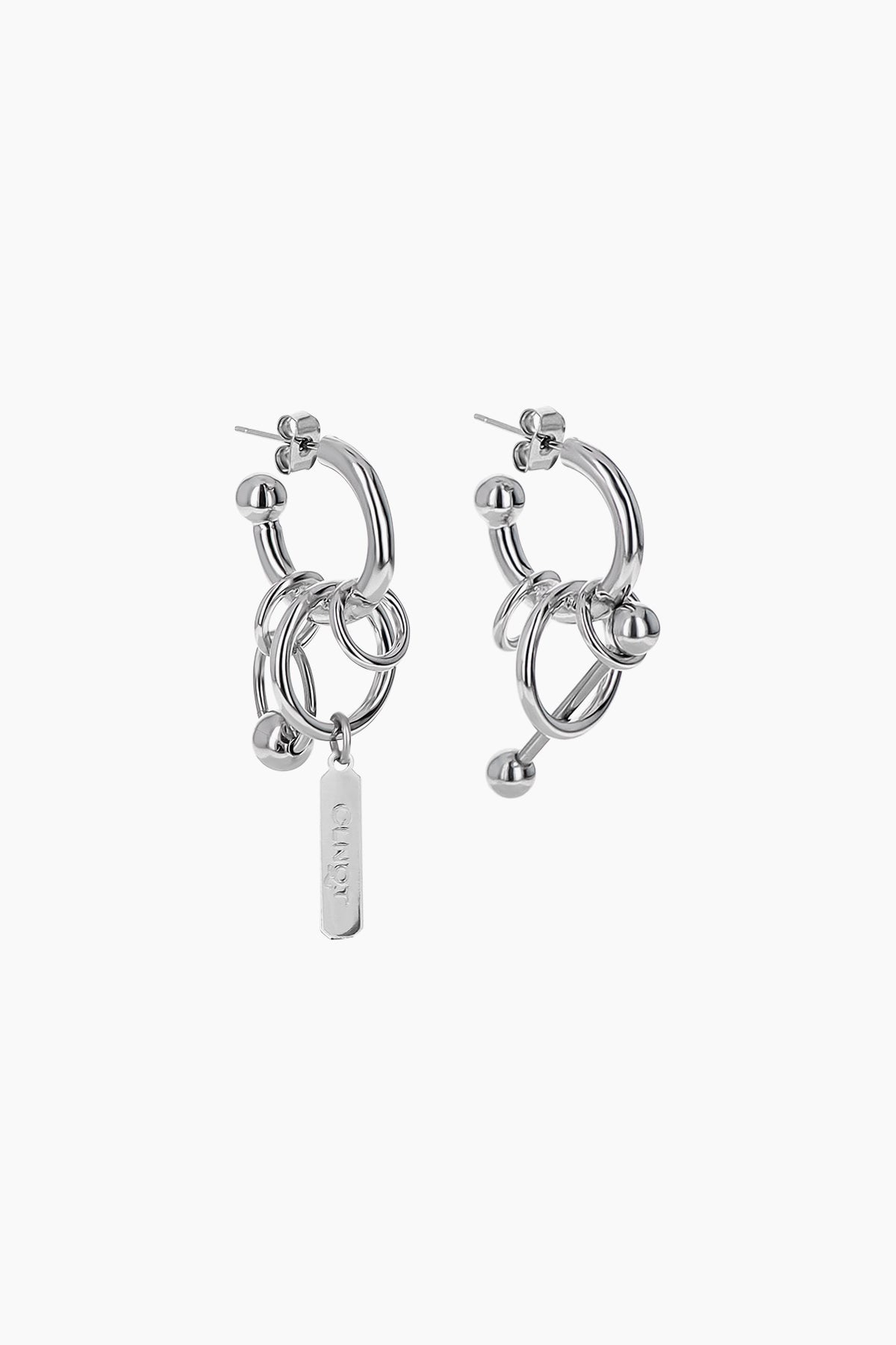 Justine Clenquet Joyce mismatched silver-tone hoop earrings with chains, rings, and a logo charm