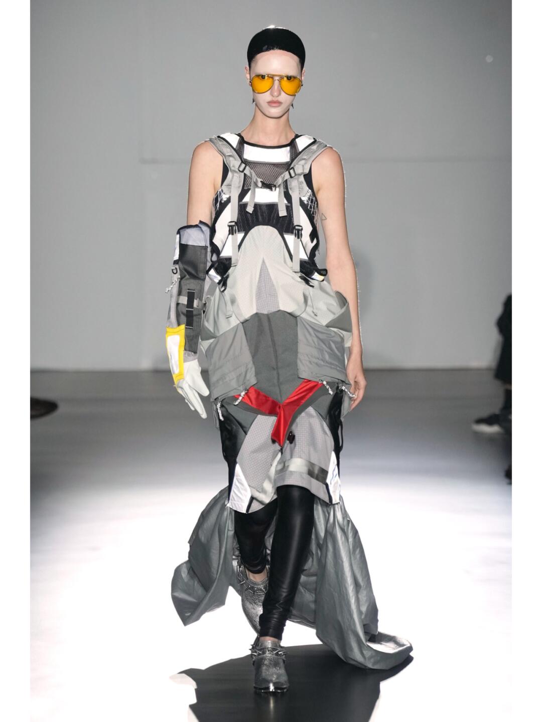 Sleeveless Junya Watanabe SS2025 cyborg look with grey panels, visor and red utility detail