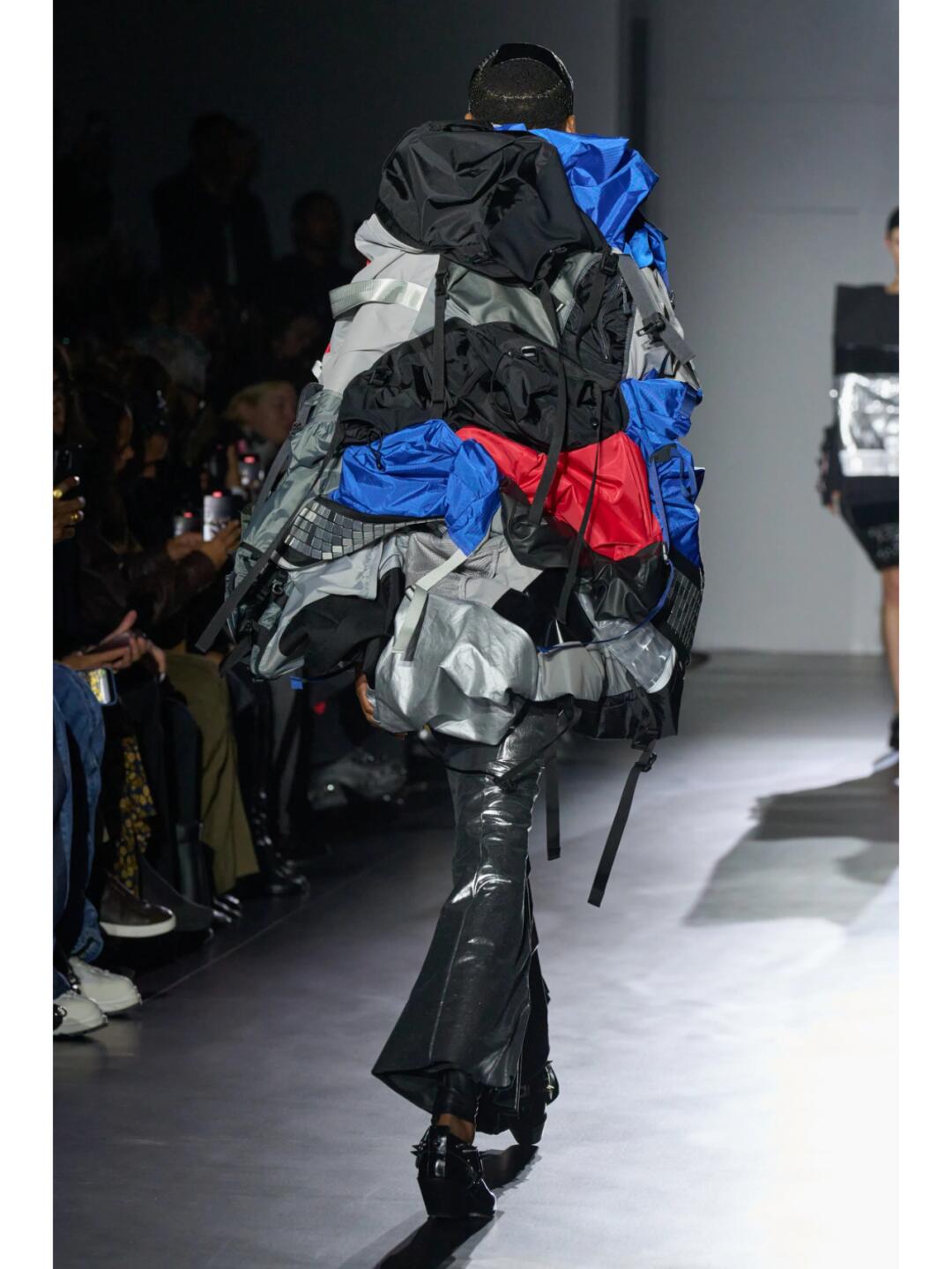 Junya Watanabe SS2025 layered recycled look with grey, black, blue and red fabric fragments