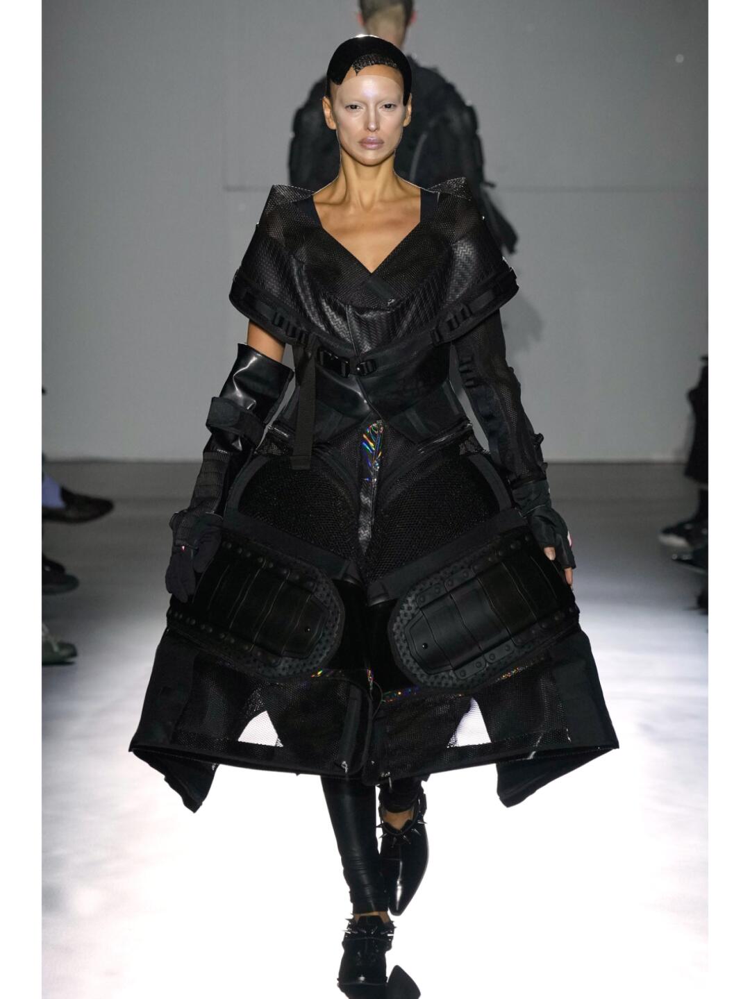 Black Junya Watanabe SS2025 look with deep layered volume and a wide technical silhouette