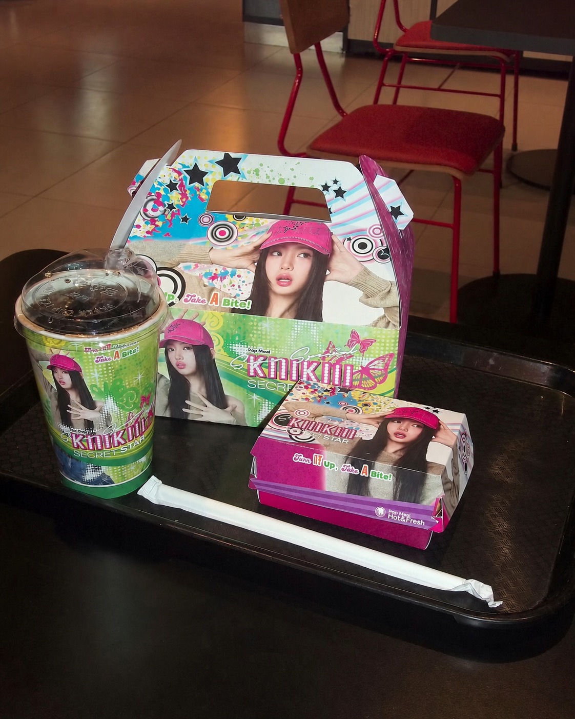 KiiiKiii-themed food packaging and drink on a tray