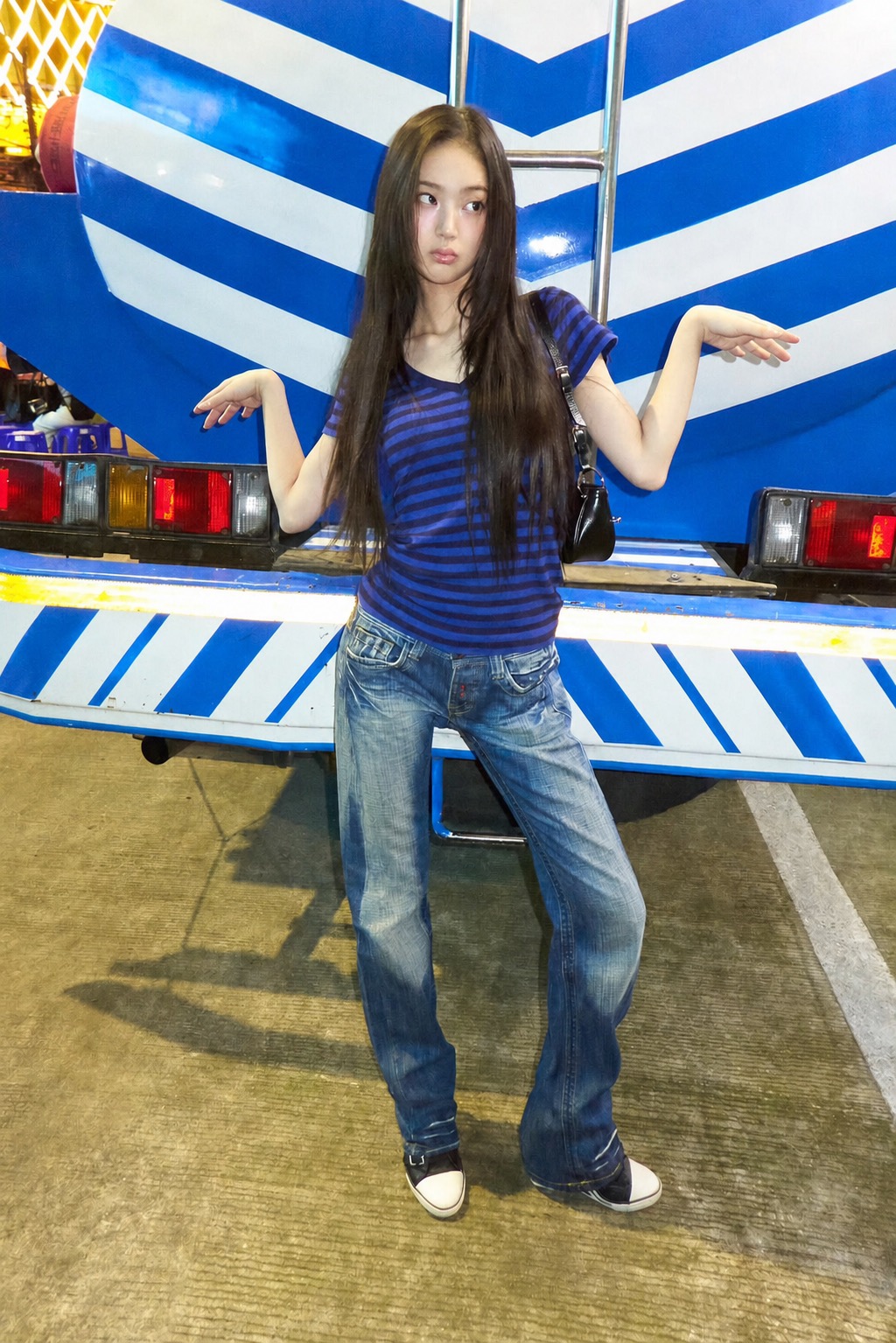 Blue striped top and jeans styled against a blue-striped vehicle