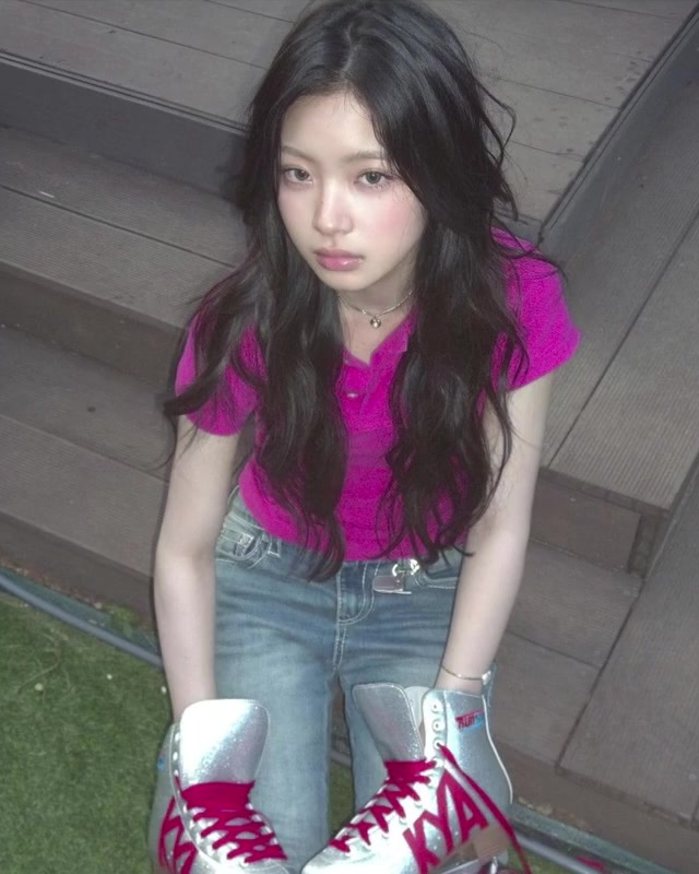 High-saturation pink top styled with denim in a KiiiKiii-inspired outfit.