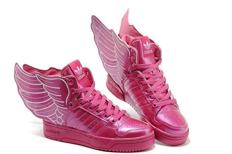 Pair of glossy pink adidas high-tops with large stitched wing panels, matching laces and pink soles.