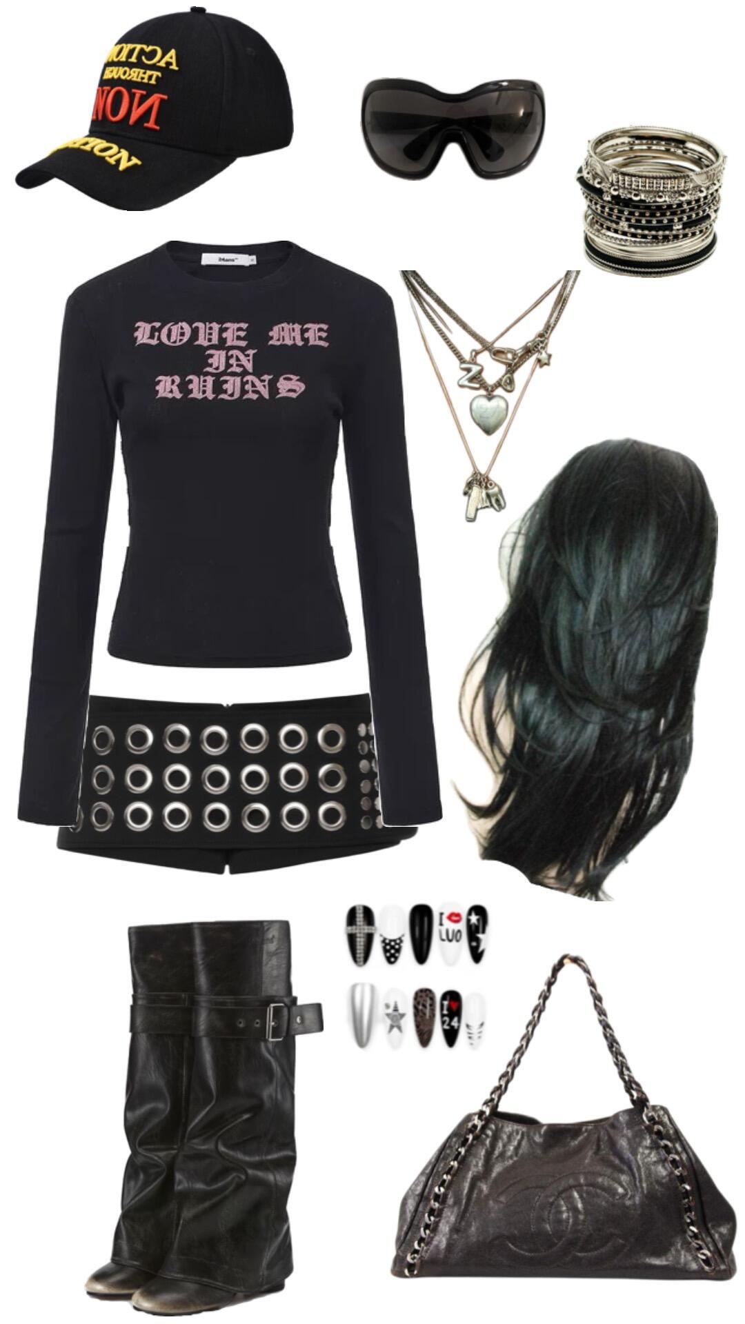 Black graphic top with goggle sunglasses, silver bangles, chain bag, and heavy boots