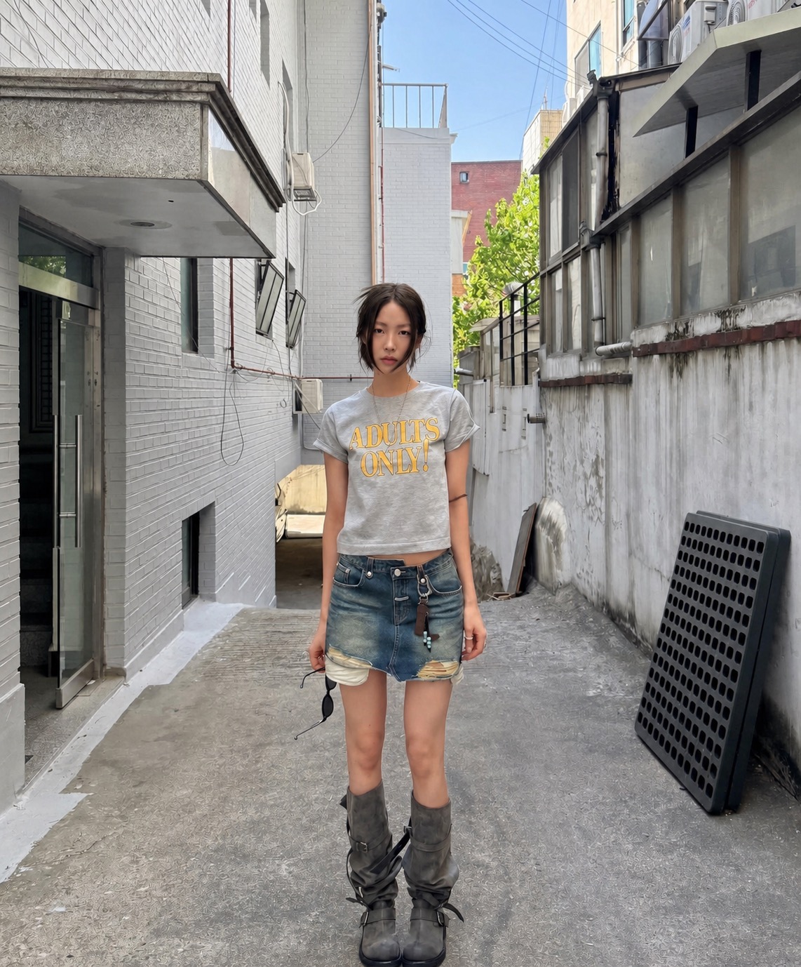 A muted city outfit with wide-leg denim and relaxed soft grunge styling
