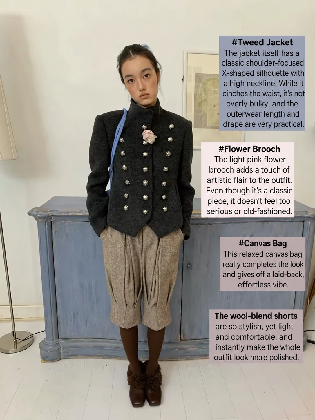 Black double-breasted jacket with a floral brooch, tan shorts and brown tights