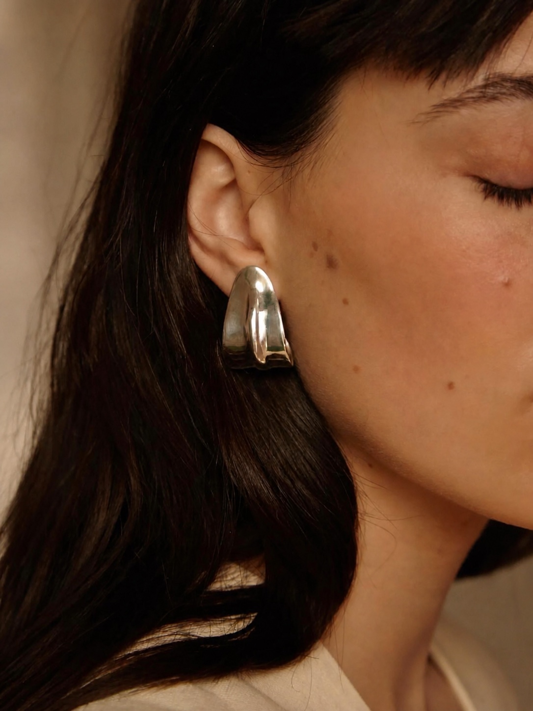 Nathalie Schreckenberg jewelry worn with white clothing