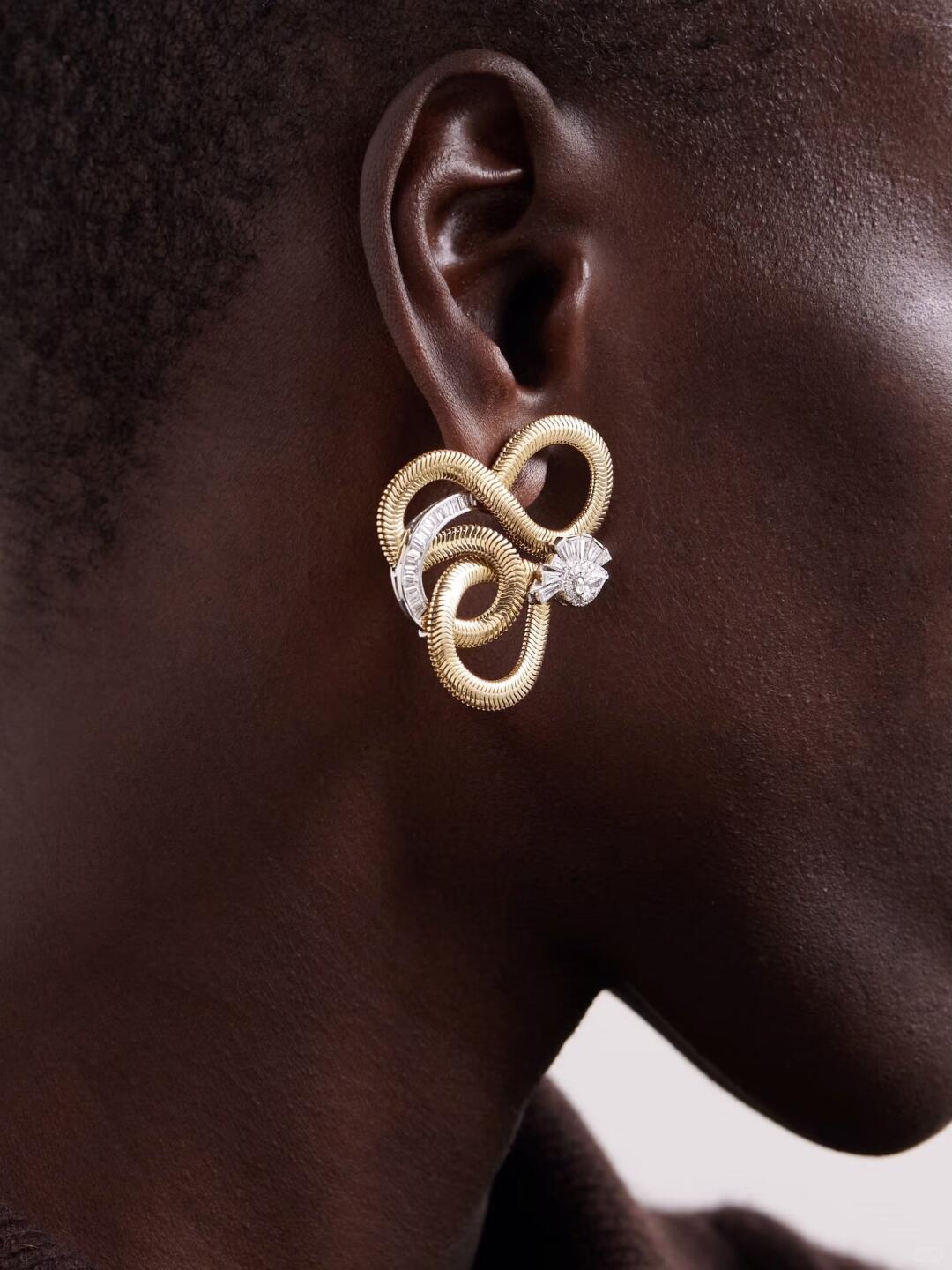 Gold and silver loop earring from the Nikos Koulis jewelry world
