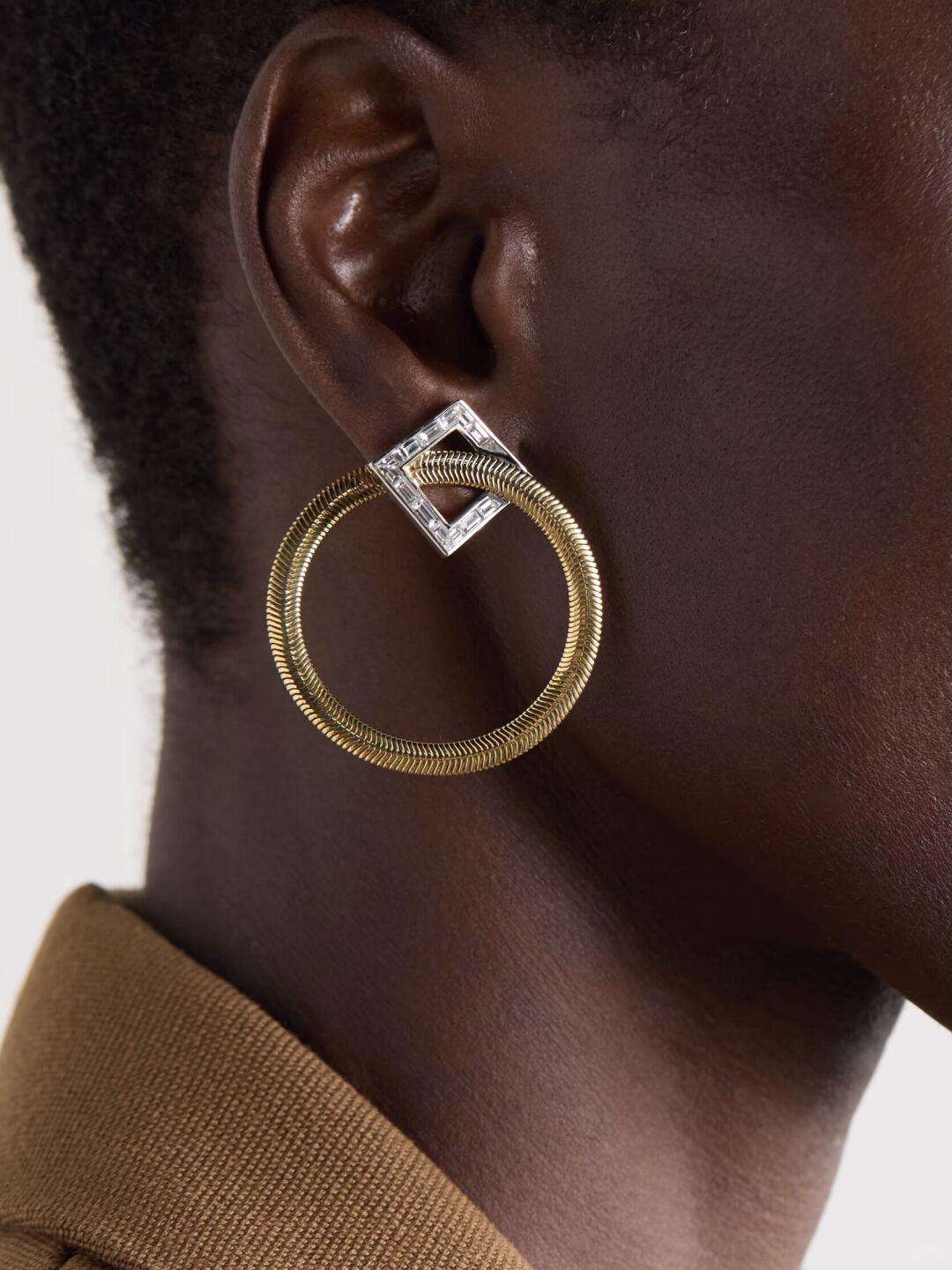 Large gold Nikos Koulis loop earring with a square top