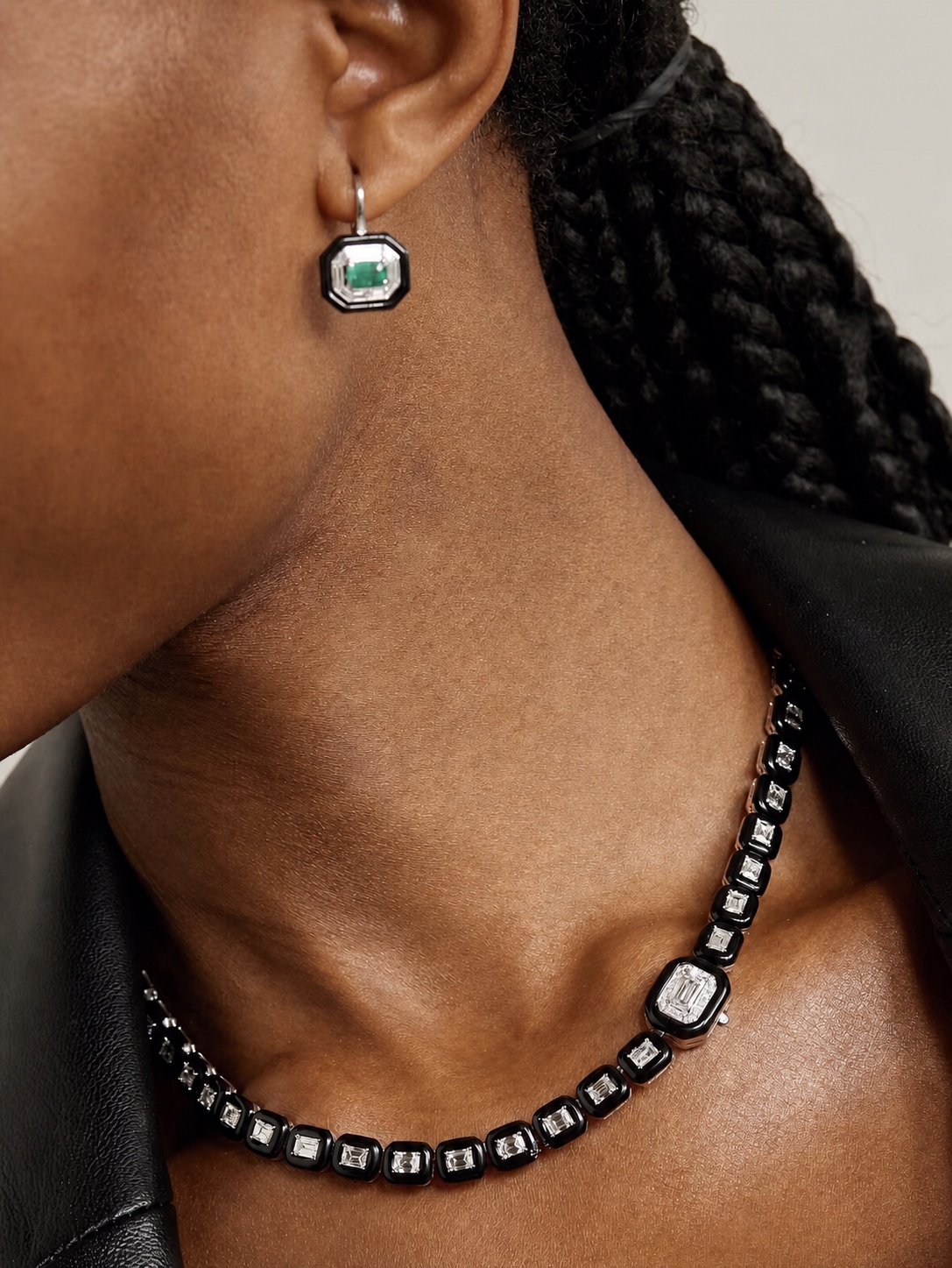 Black, white, and green Nikos Koulis earring with a matching necklace