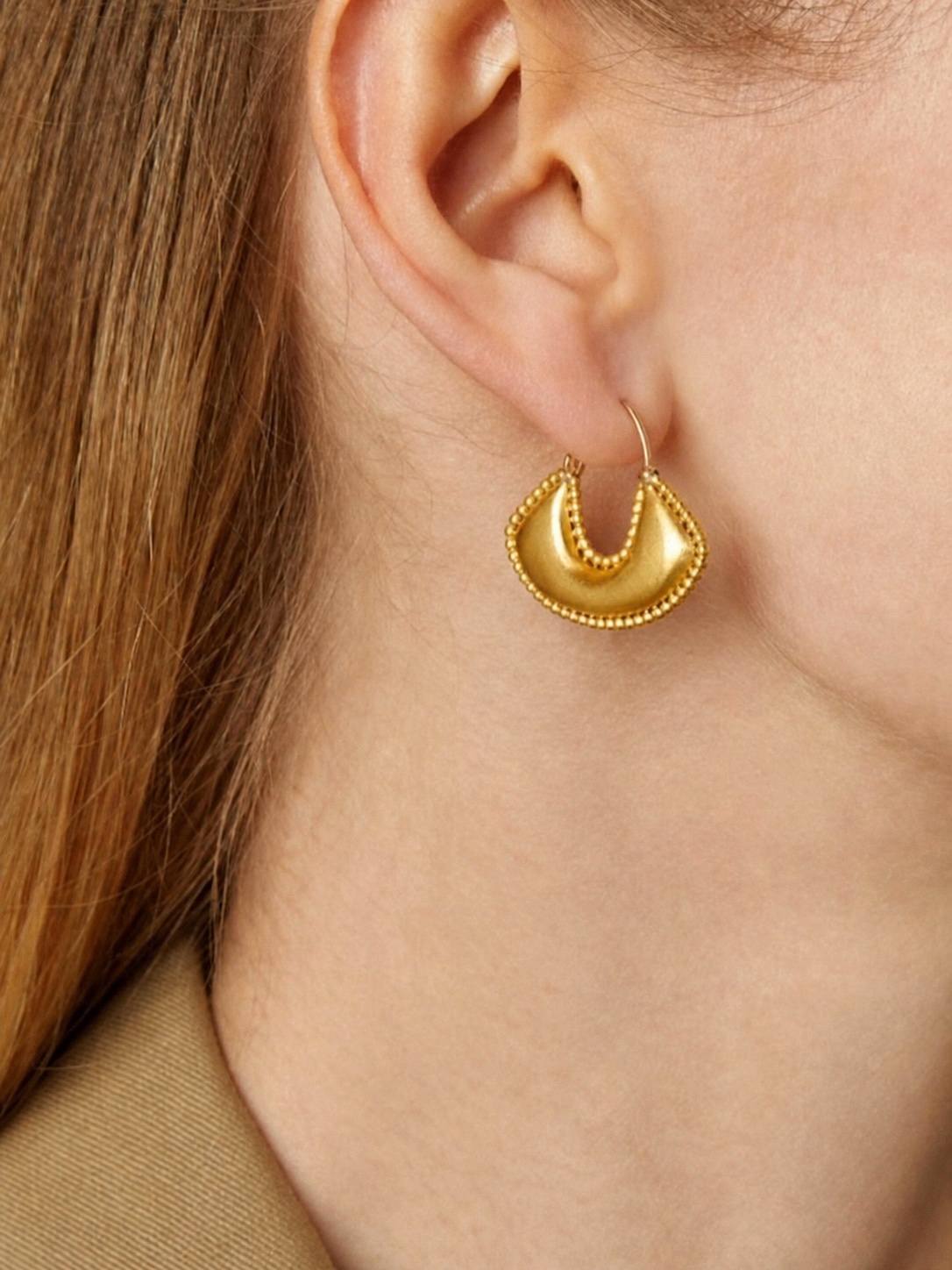 PROUNIS jewelry styled with a white garment