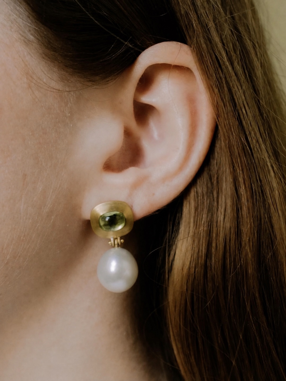 PROUNIS jewelry worn in a layered look