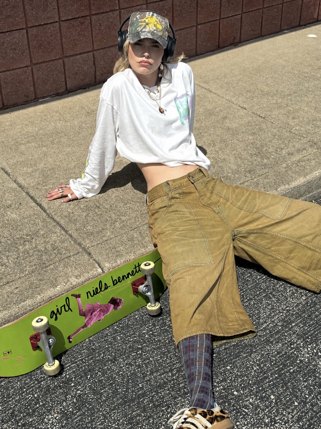 Street punk outfit with relaxed trousers, small top and silver accents