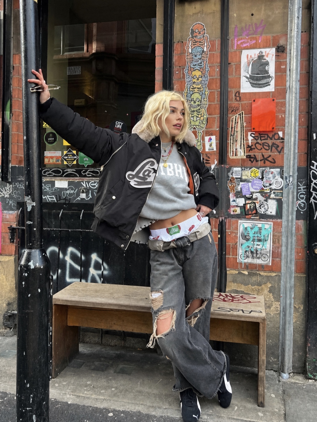 Skater-leaning punk outfit with oversized shape and graphic styling