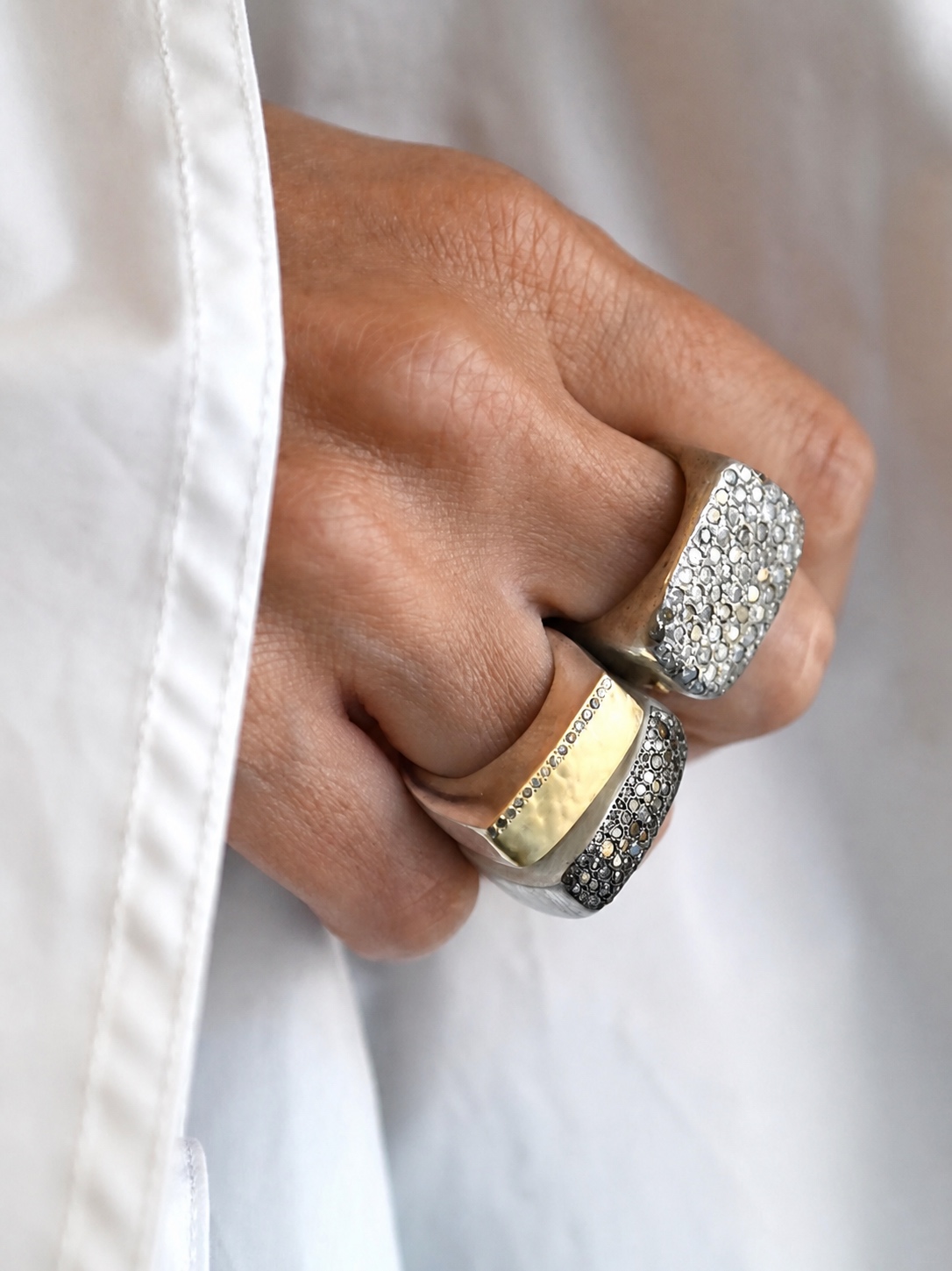 Rosa Maria rings layered across a hand