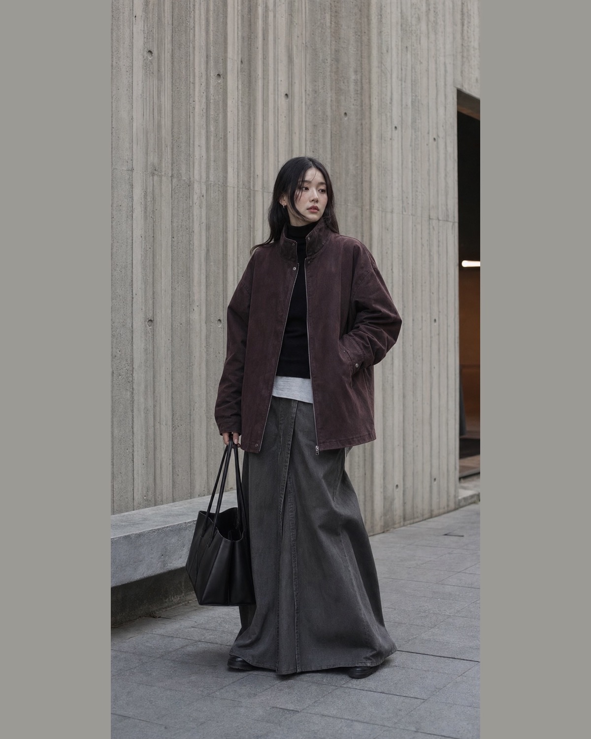 Oversized burgundy-charcoal jacket, black turtleneck, grey maxi layer and structured tote