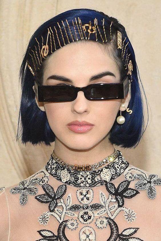 Statement accessories with dramatic hair and face framing
