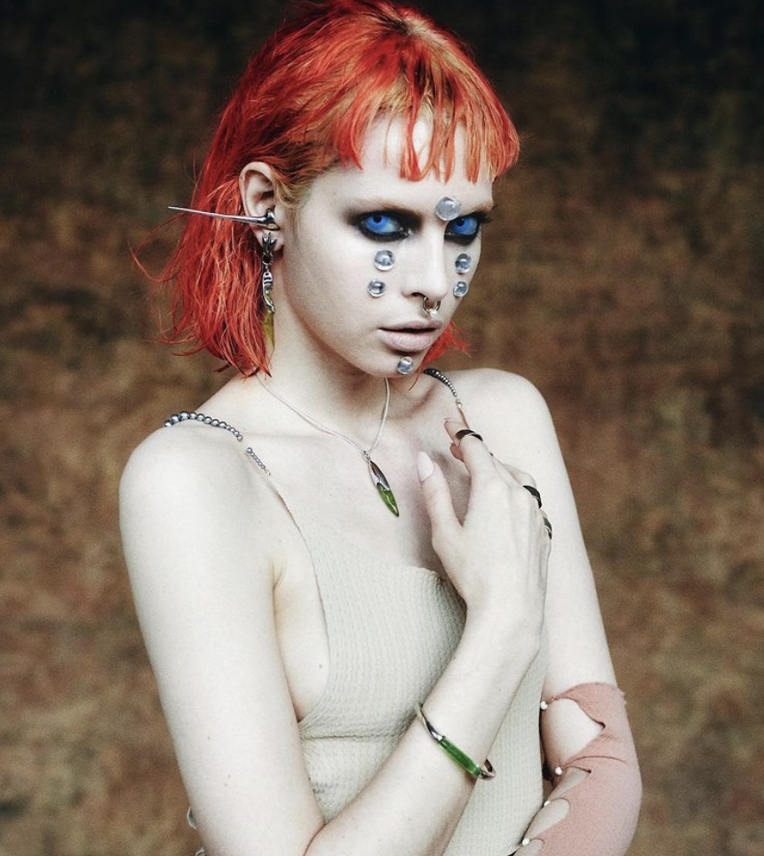 Model wearing a green Spice pendant, matching bracelet and facial adornments in the CHRISHABANA x DUNE lookbook.