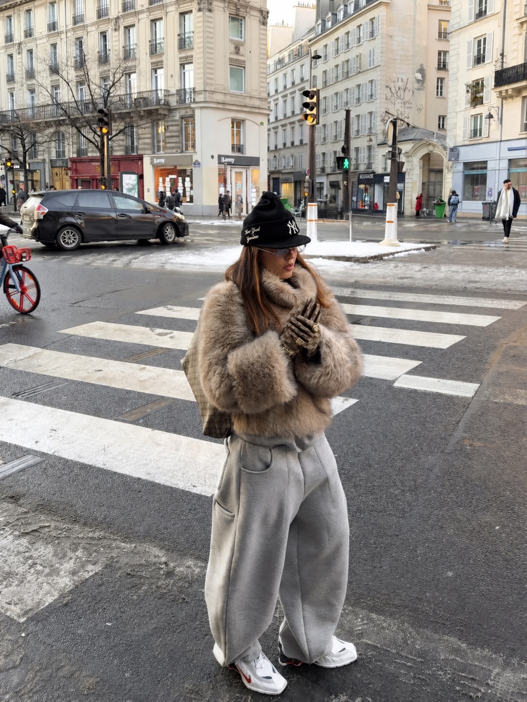 wide trousers and cropped top with a vintage athletic jacket