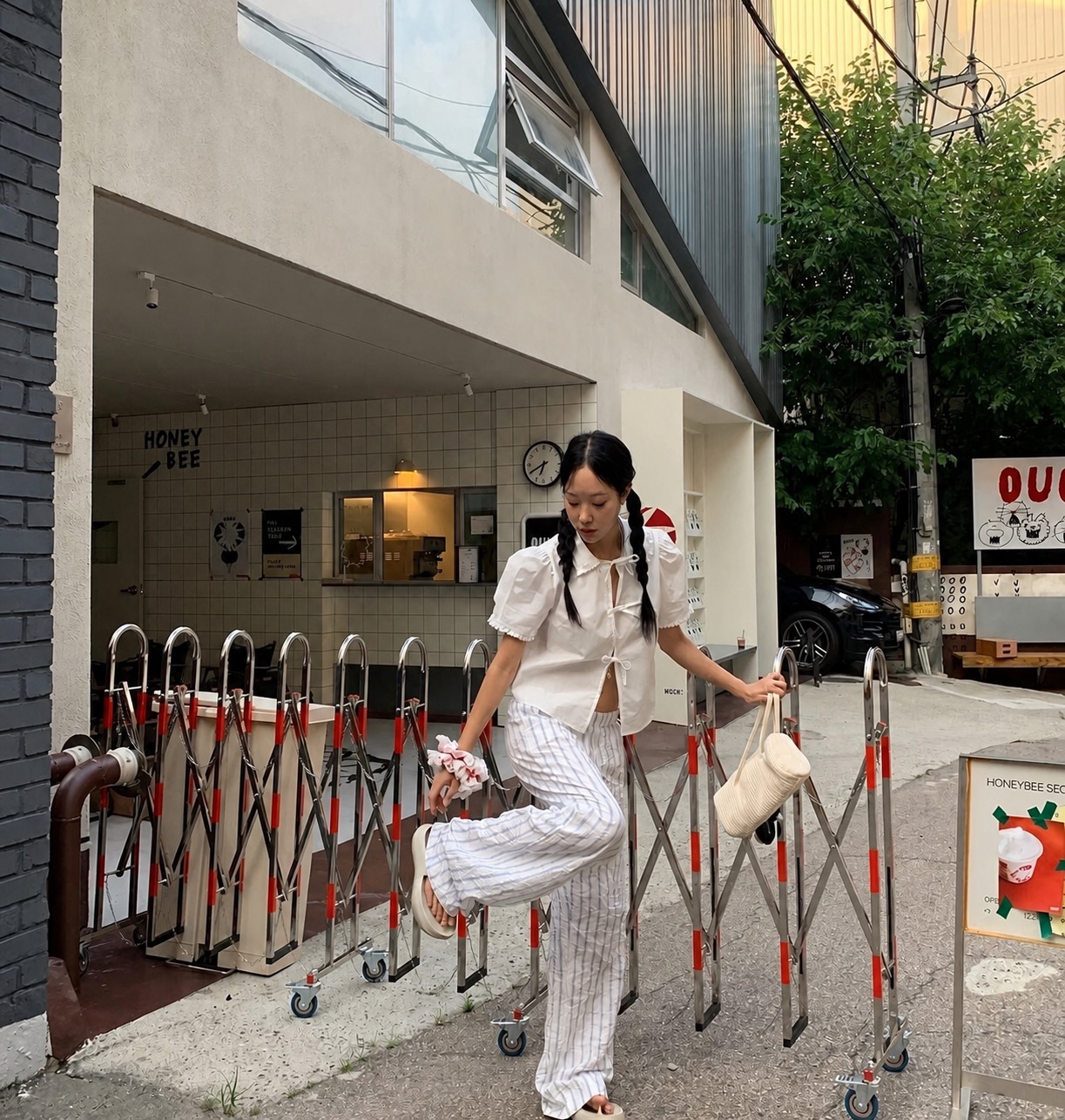 A relaxed streetwear outfit with baggy pants and sporty Korean styling