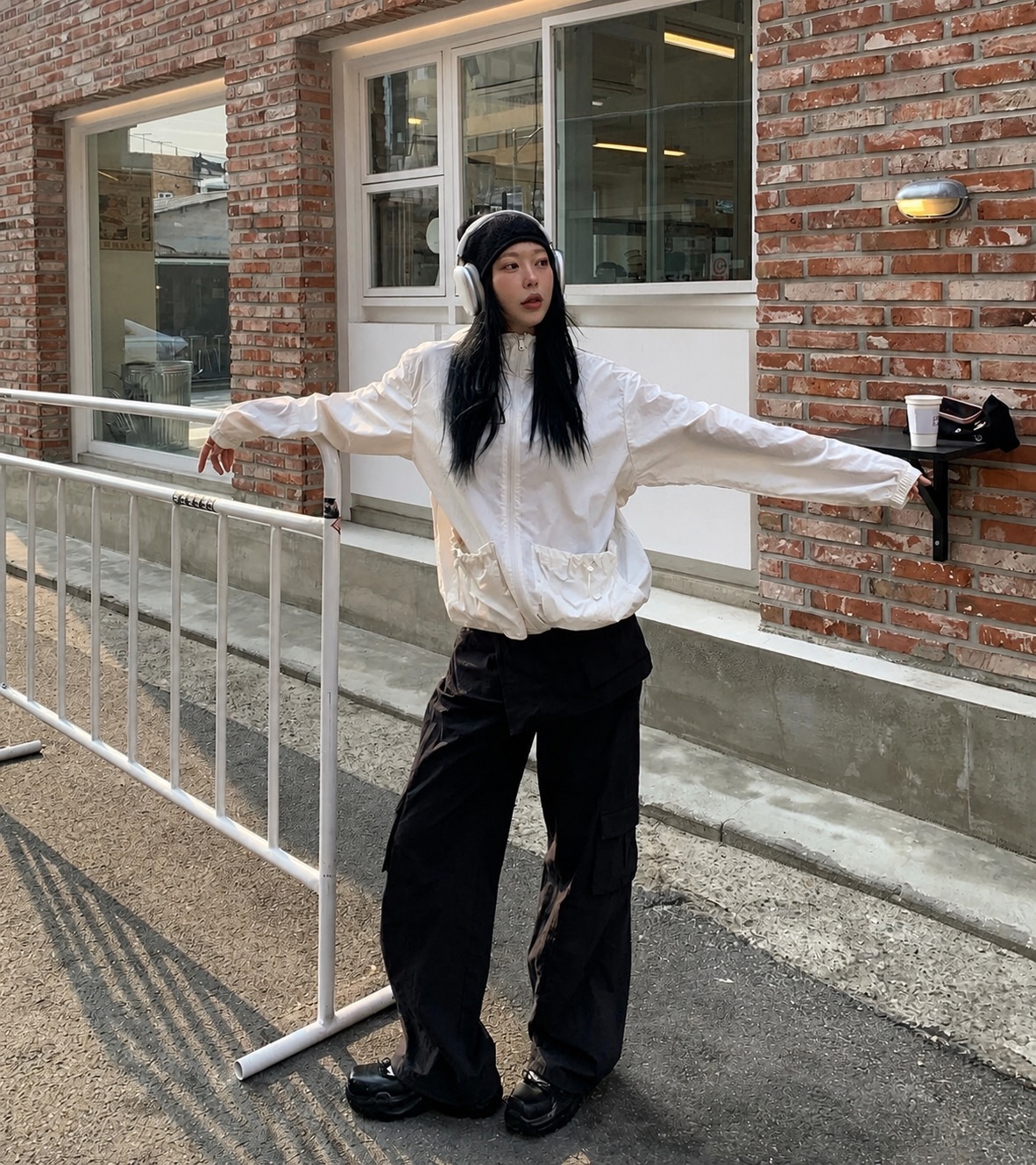An oversized T-shirt outfit with sporty casual proportions and a soft palette