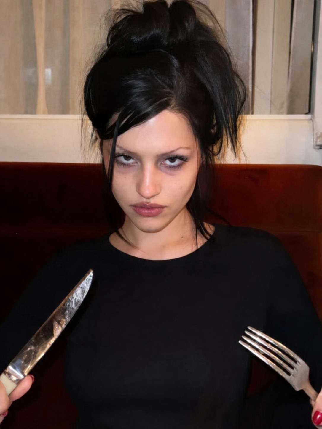 Succubus chic fashion reference with black dress, sharp eye makeup and gothic glamour