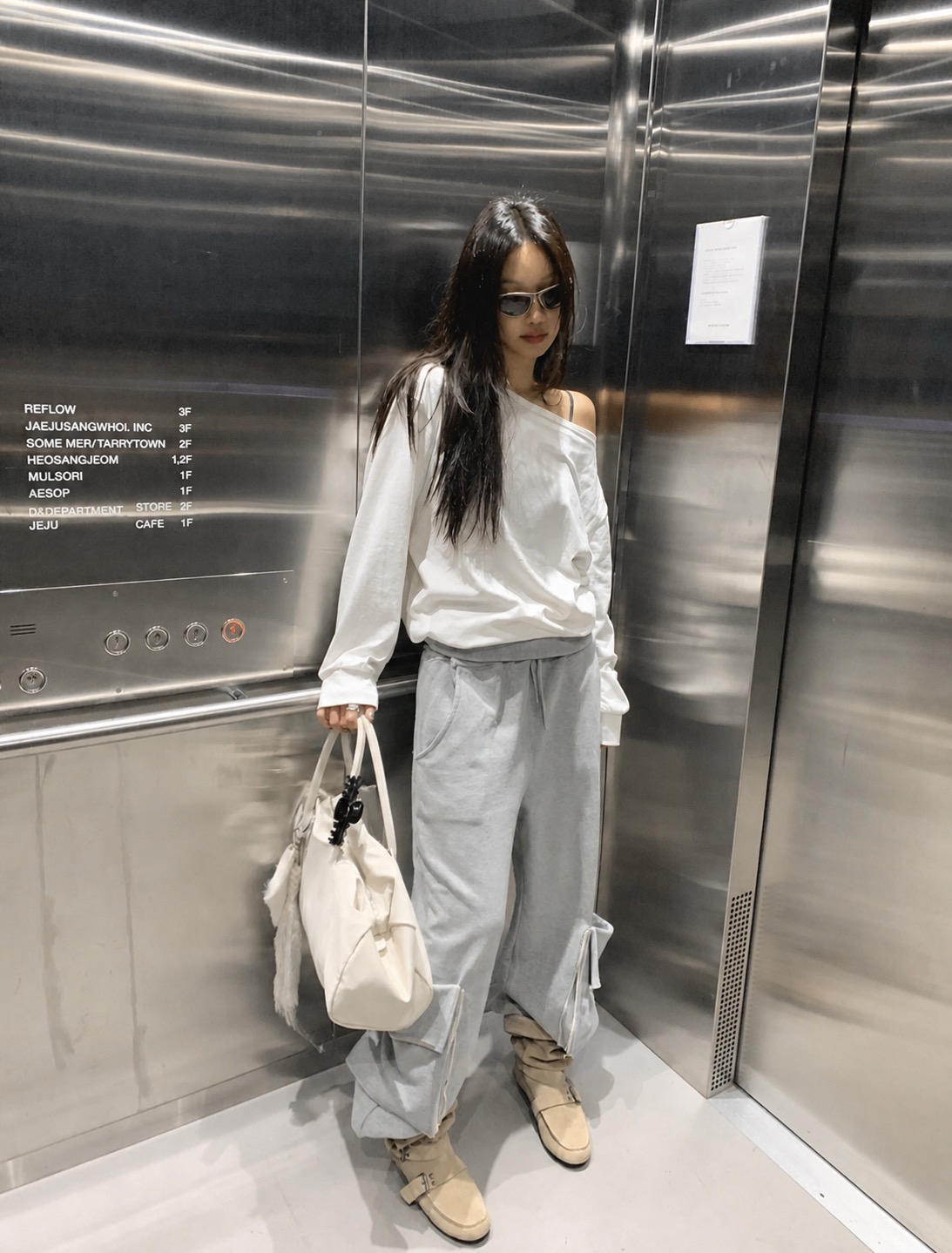 A loose summer outfit with muted tones and easy Korean street style proportions